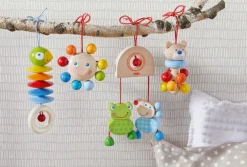 HABA Dangling Figure Parrot Stroller & Crib Toy< Play Gyms, Play Mats + Accessories
